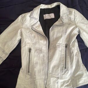 A white grey and blue leather jacket